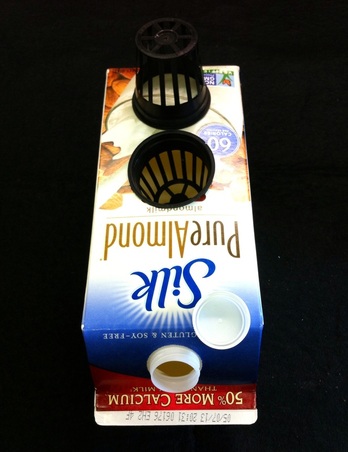 Milk carton with net pot.